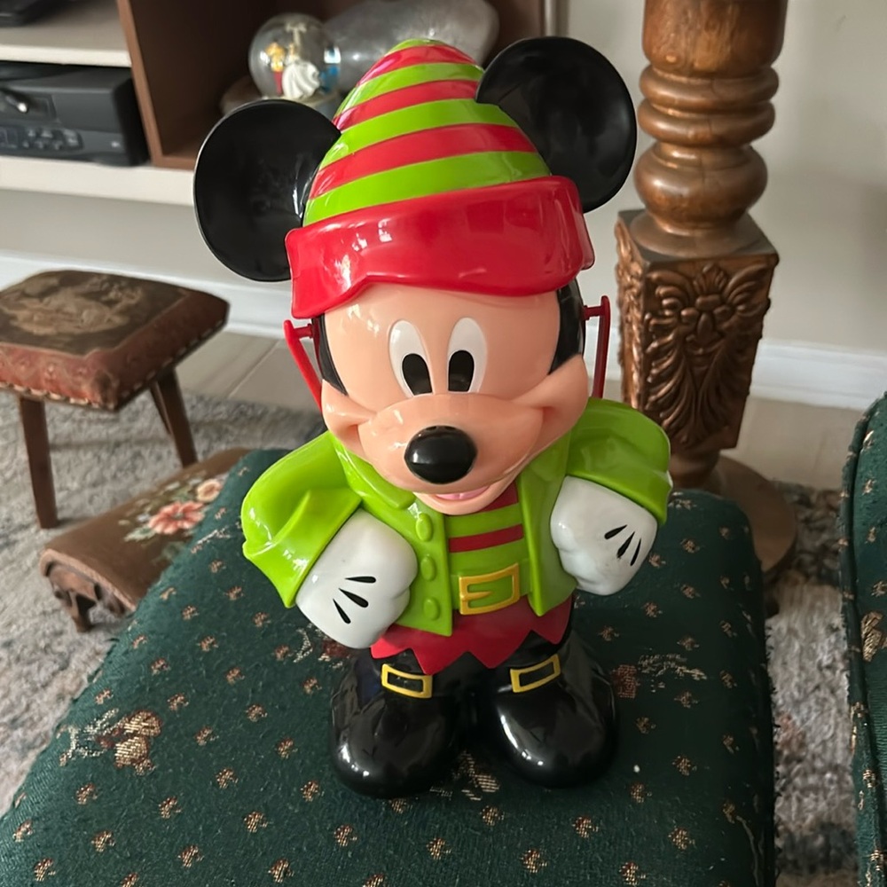 Disney’s Mickey elf popcorn bucket approximately 12 inches has handle red green